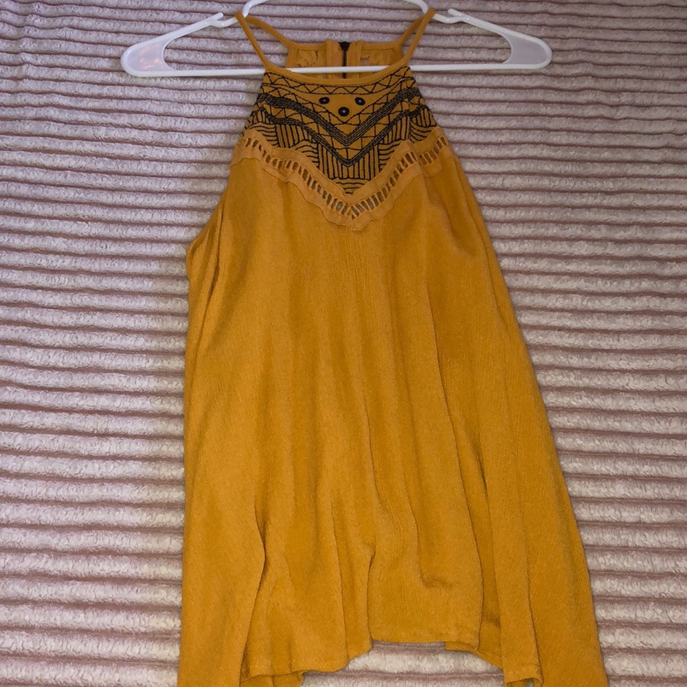 Yellow dressy shirt.